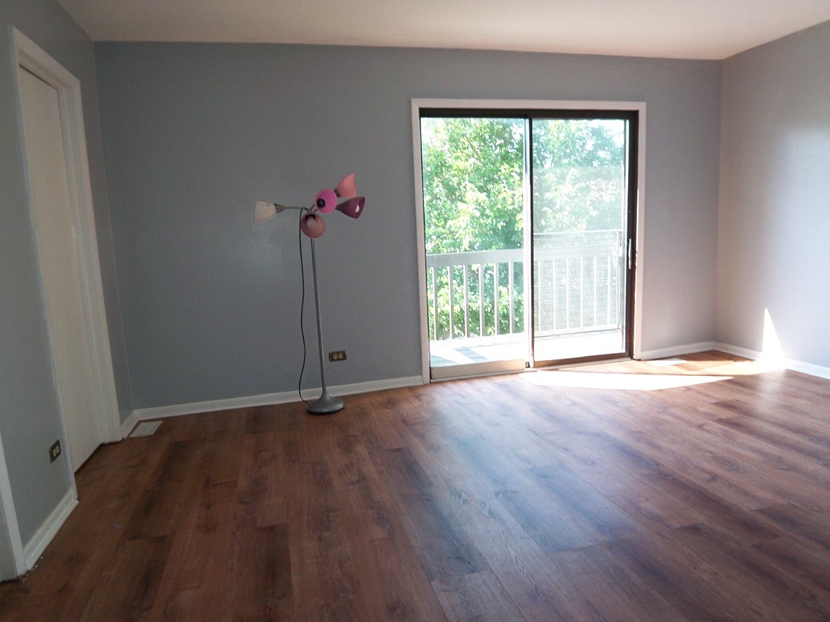1925 Georgetown Lane Hoffman Estates, IL 60169 - Photo 18 of 29 a view of a room with wooden floor and window