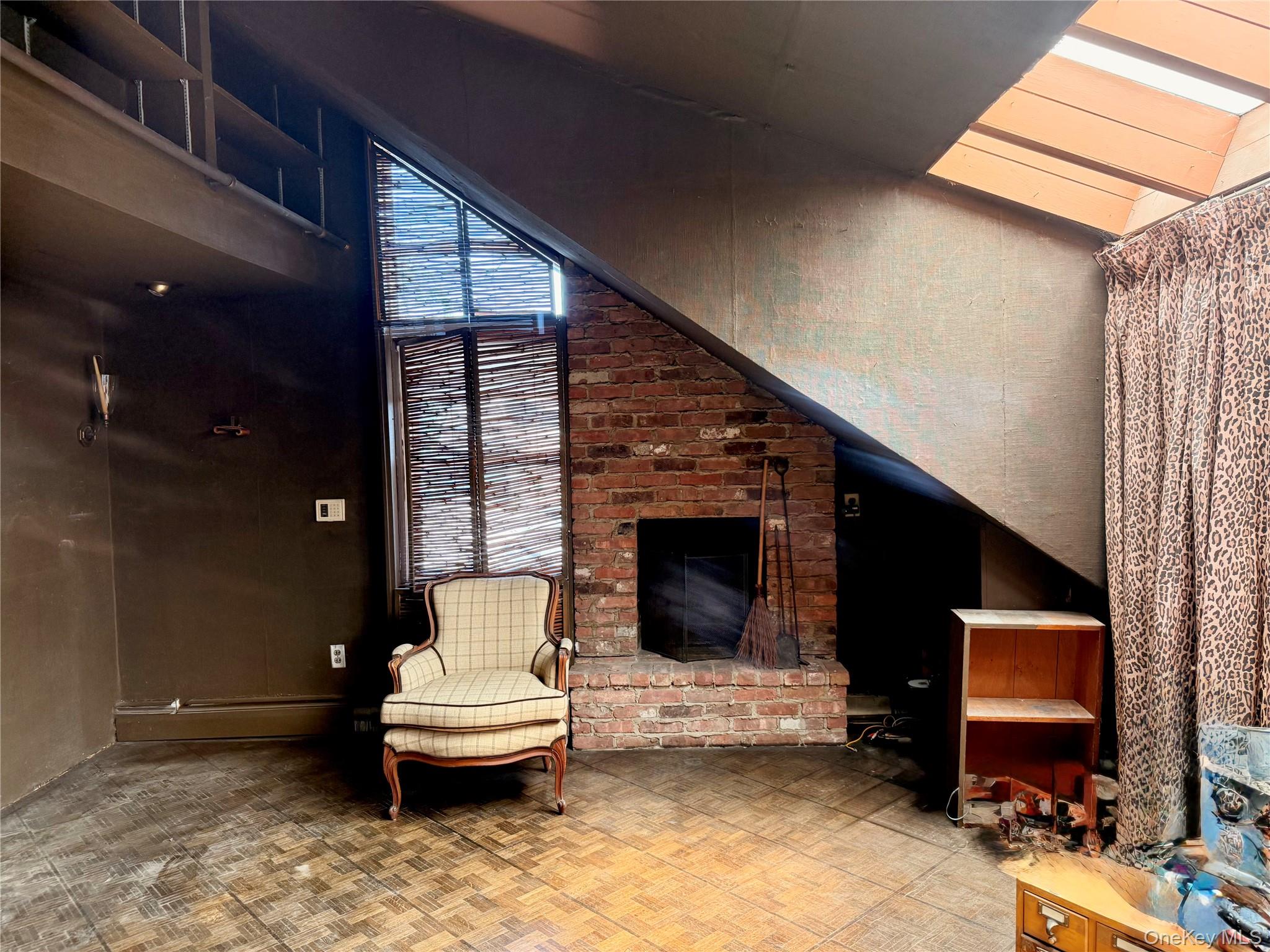 335 Arthur Street Freeport, NY 11520 - Photo 11 of 17 a living room with furniture a fireplace and a flat screen tv
