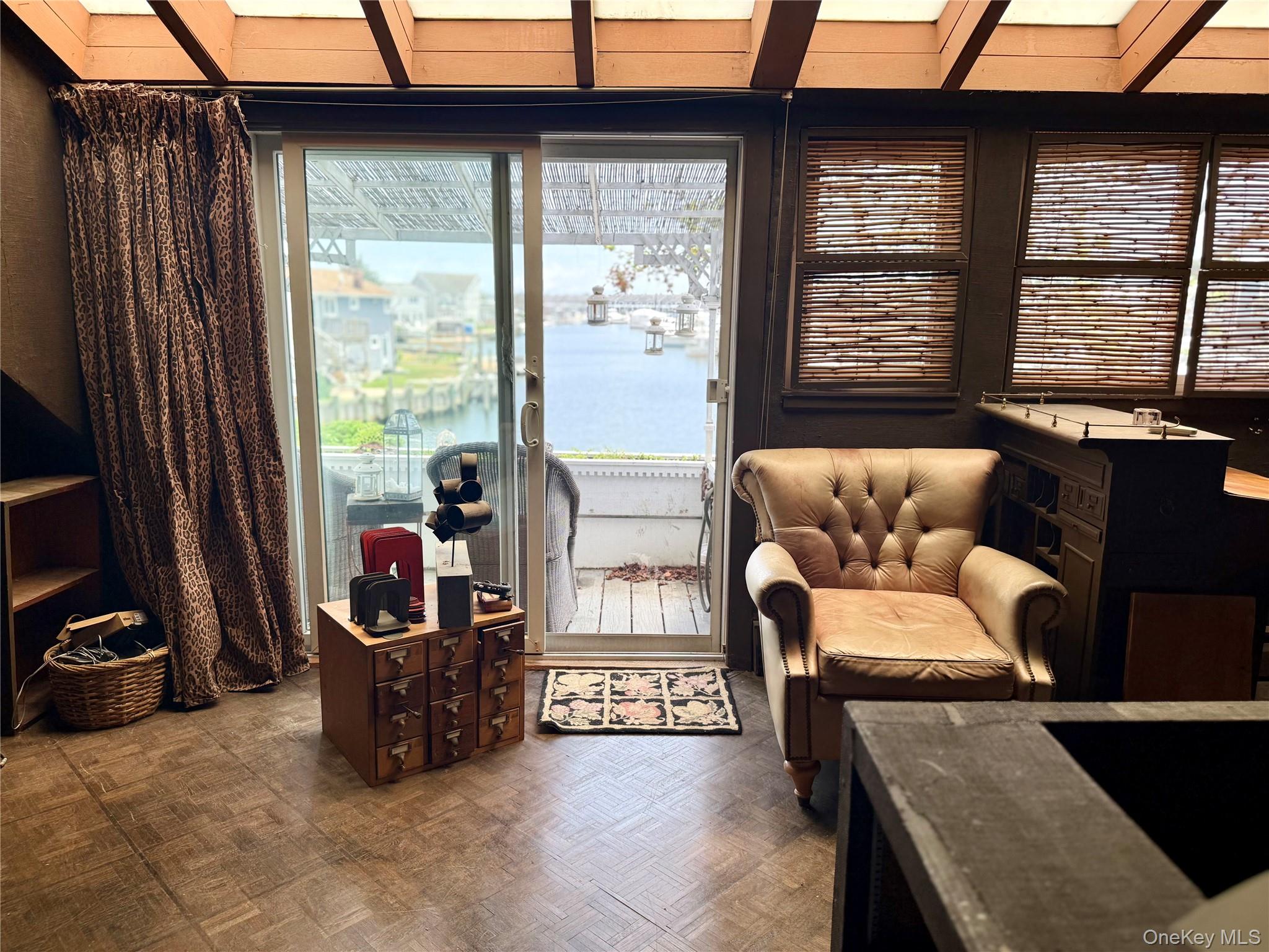 335 Arthur Street Freeport, NY 11520 - Photo 9 of 17 a living room with furniture and a window