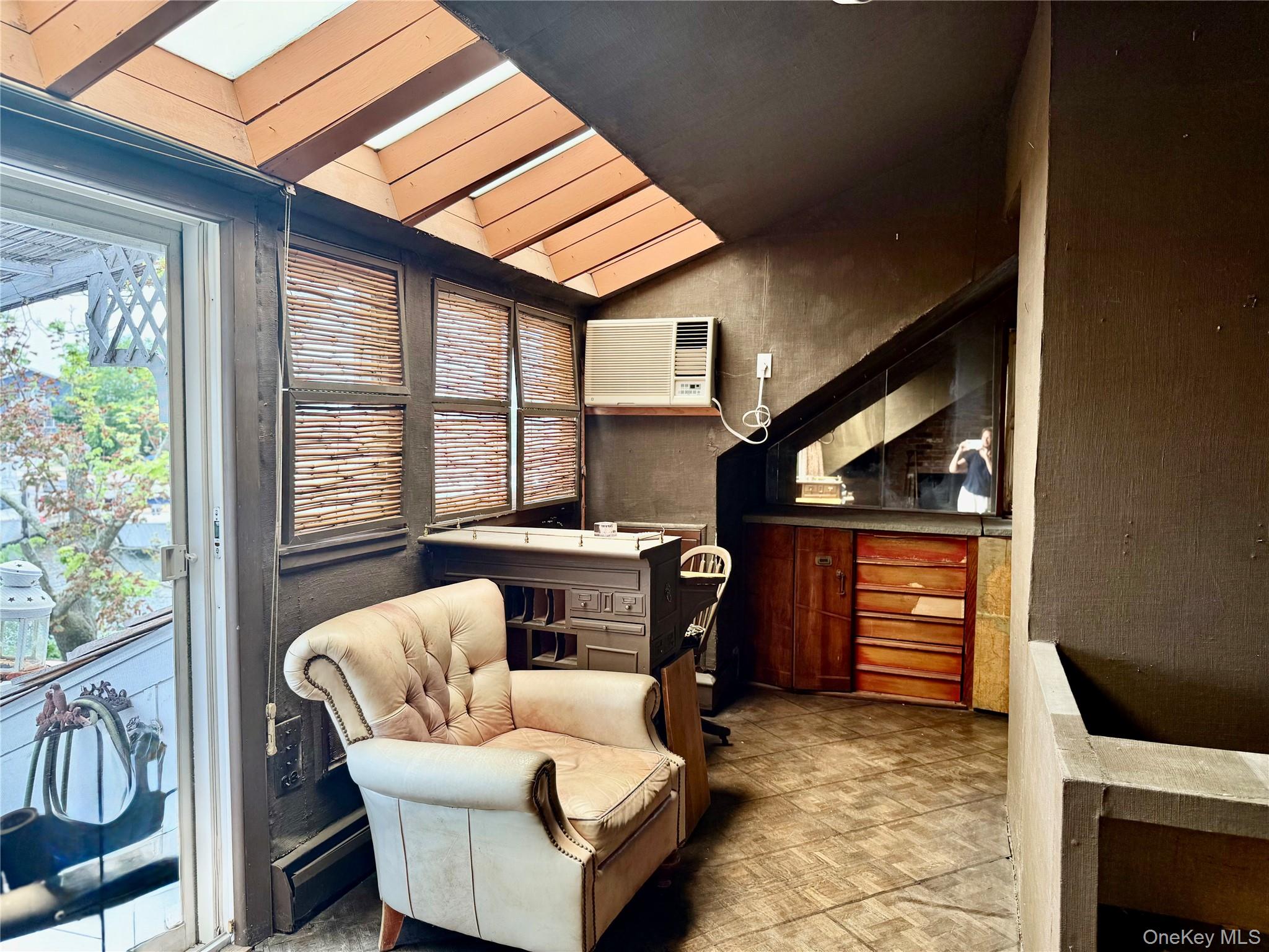 335 Arthur Street Freeport, NY 11520 - Photo 10 of 17 a living room with furniture and a window