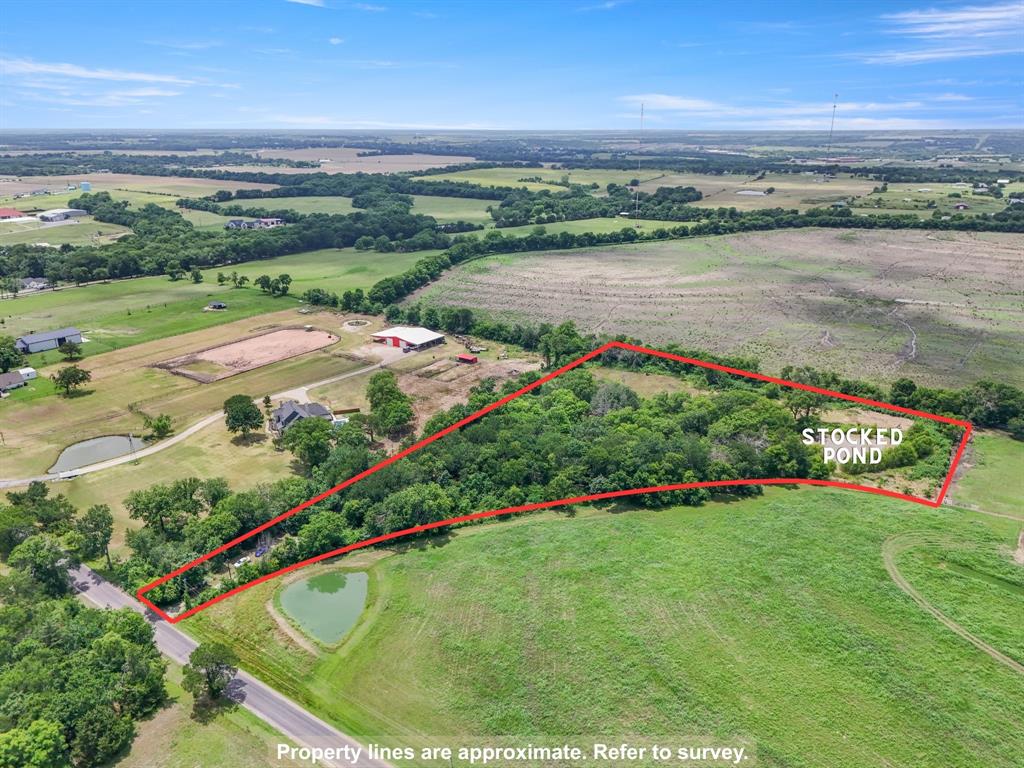 3165 Bennett Road Howe, TX 75459 - Photo 2 of 6 Wide aerial view highlighting the wooded acreage, pond area, and surrounding rural setting.