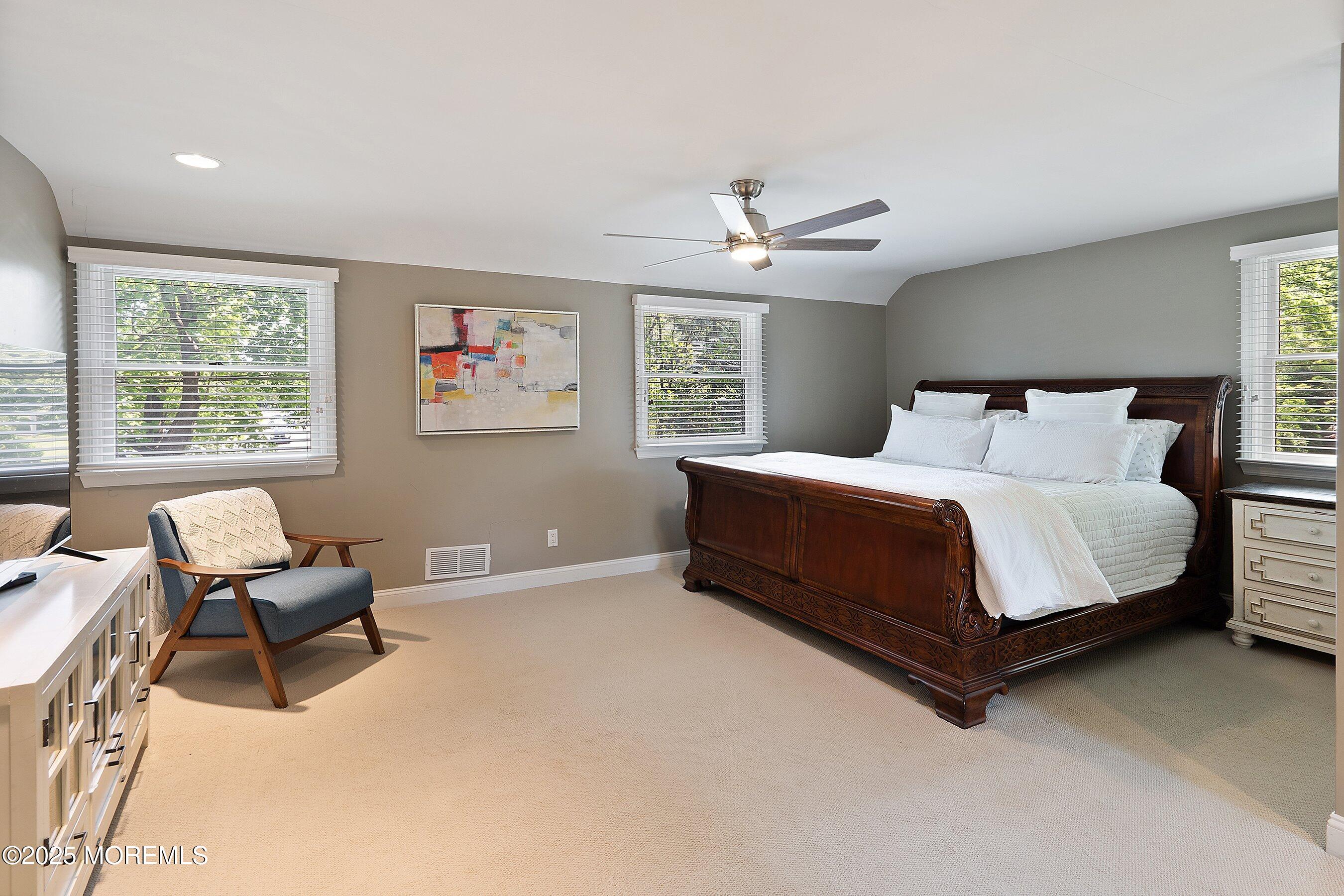 76 Ridge Road Fair Haven, NJ 07704 - Photo 13 of 22 a bedroom with a bed couch chair and a window