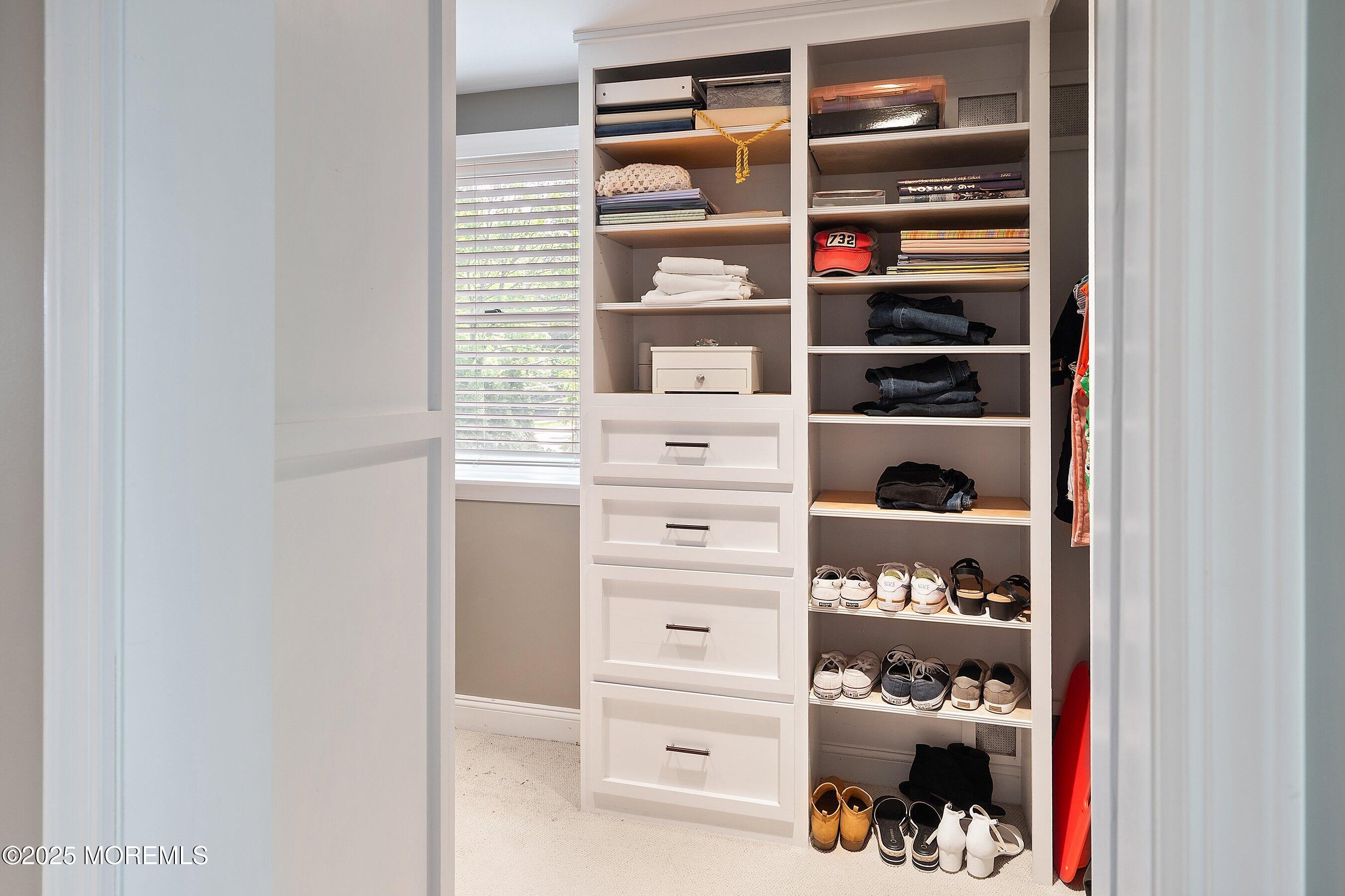 76 Ridge Road Fair Haven, NJ 07704 - Photo 16 of 22 a view of walk in closet with clothes and shoes