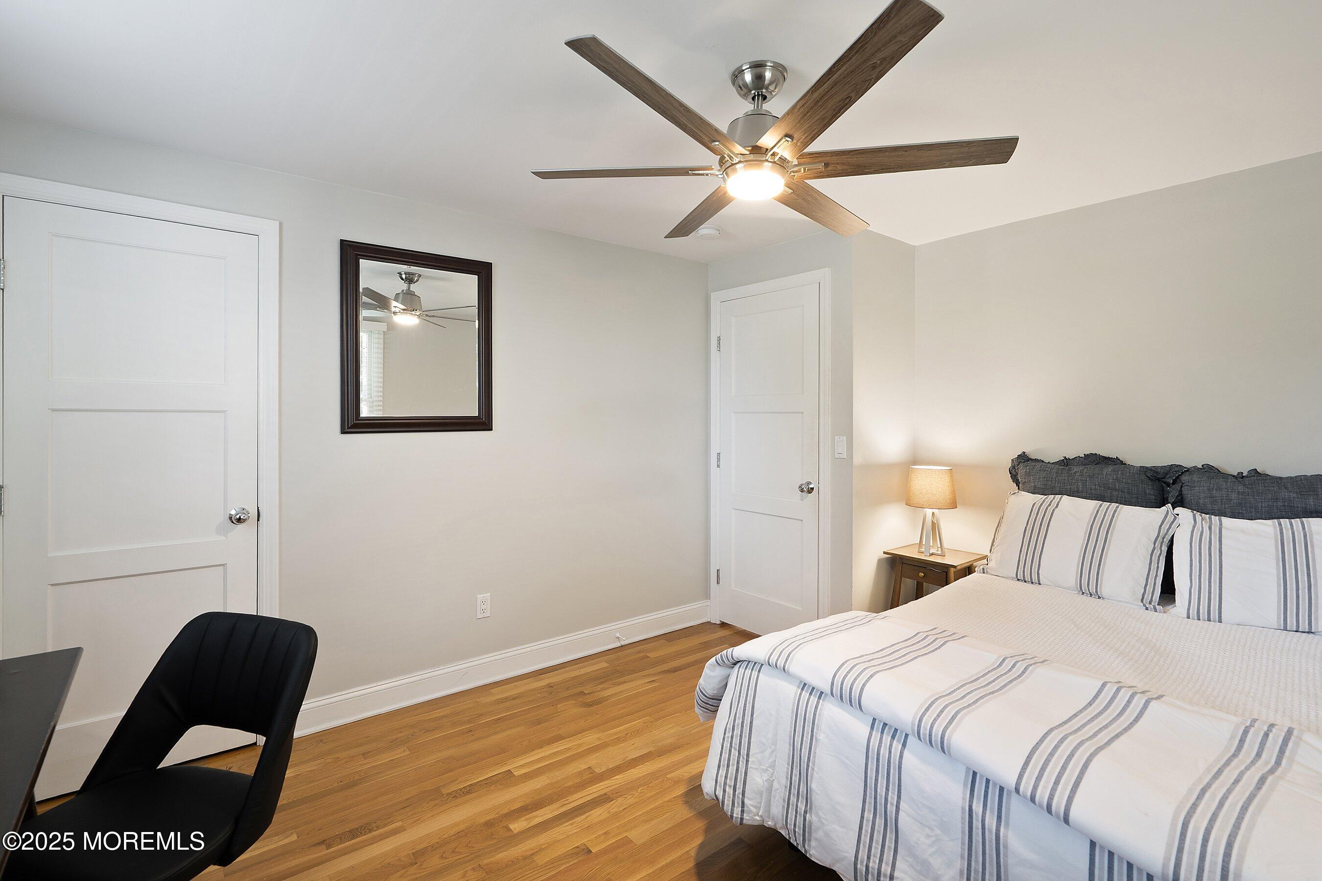 76 Ridge Road Fair Haven, NJ 07704 - Photo 17 of 22 a bedroom with a bed and a chair