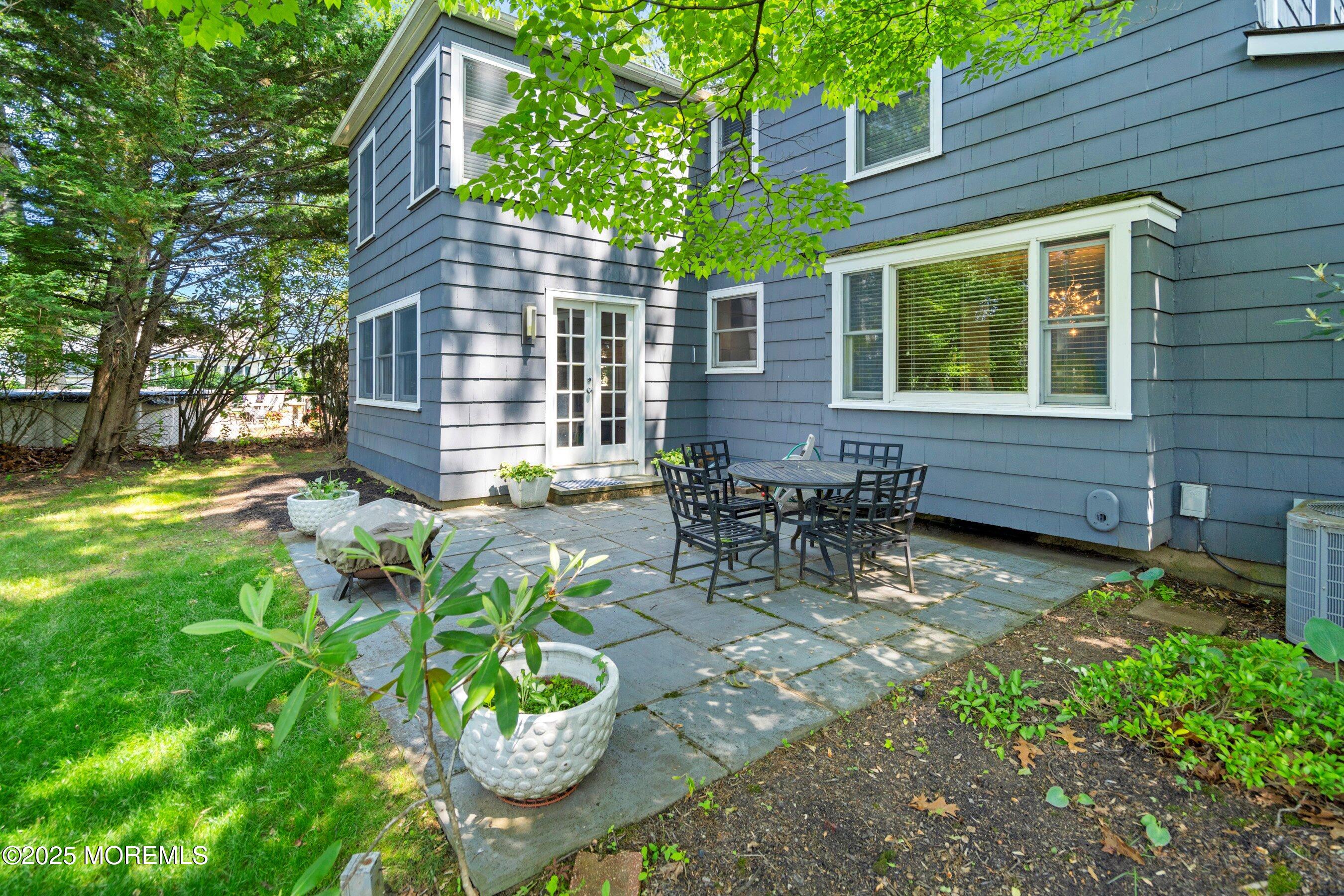 76 Ridge Road Fair Haven, NJ 07704 - Photo 21 of 22 a backyard of a house with outdoor seating