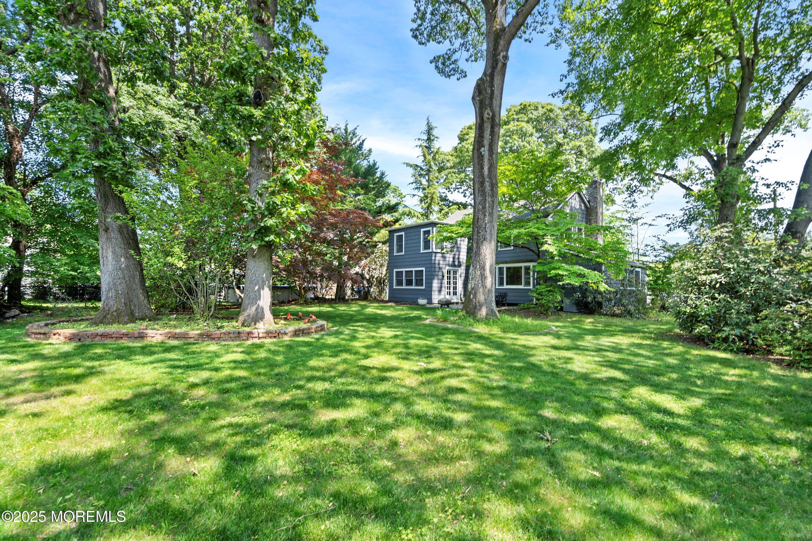 76 Ridge Road Fair Haven, NJ 07704 - Photo 22 of 22 a view of a house with a yard
