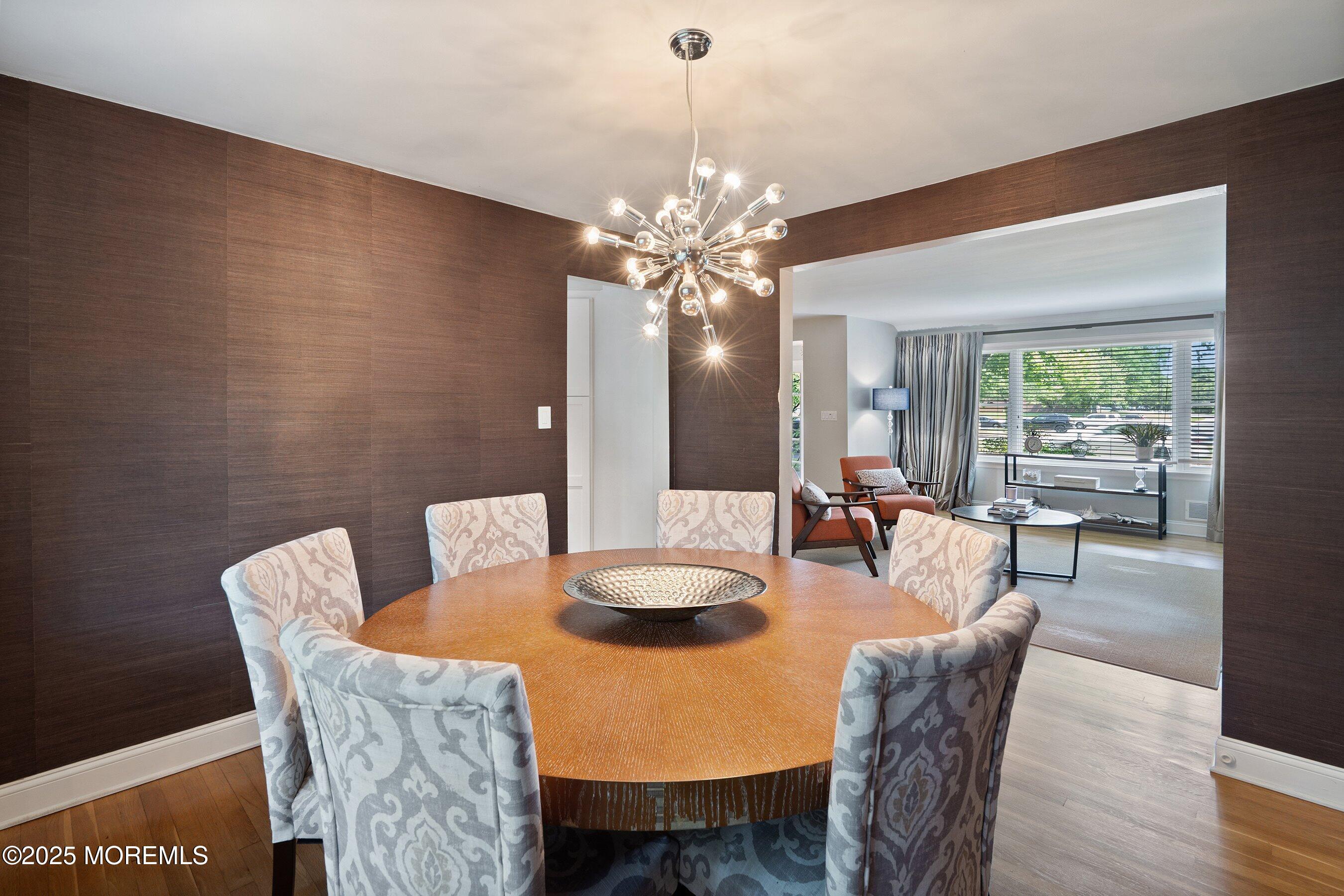 76 Ridge Road Fair Haven, NJ 07704 - Photo 5 of 22 a dining room with furniture a chandelier and wooden floor