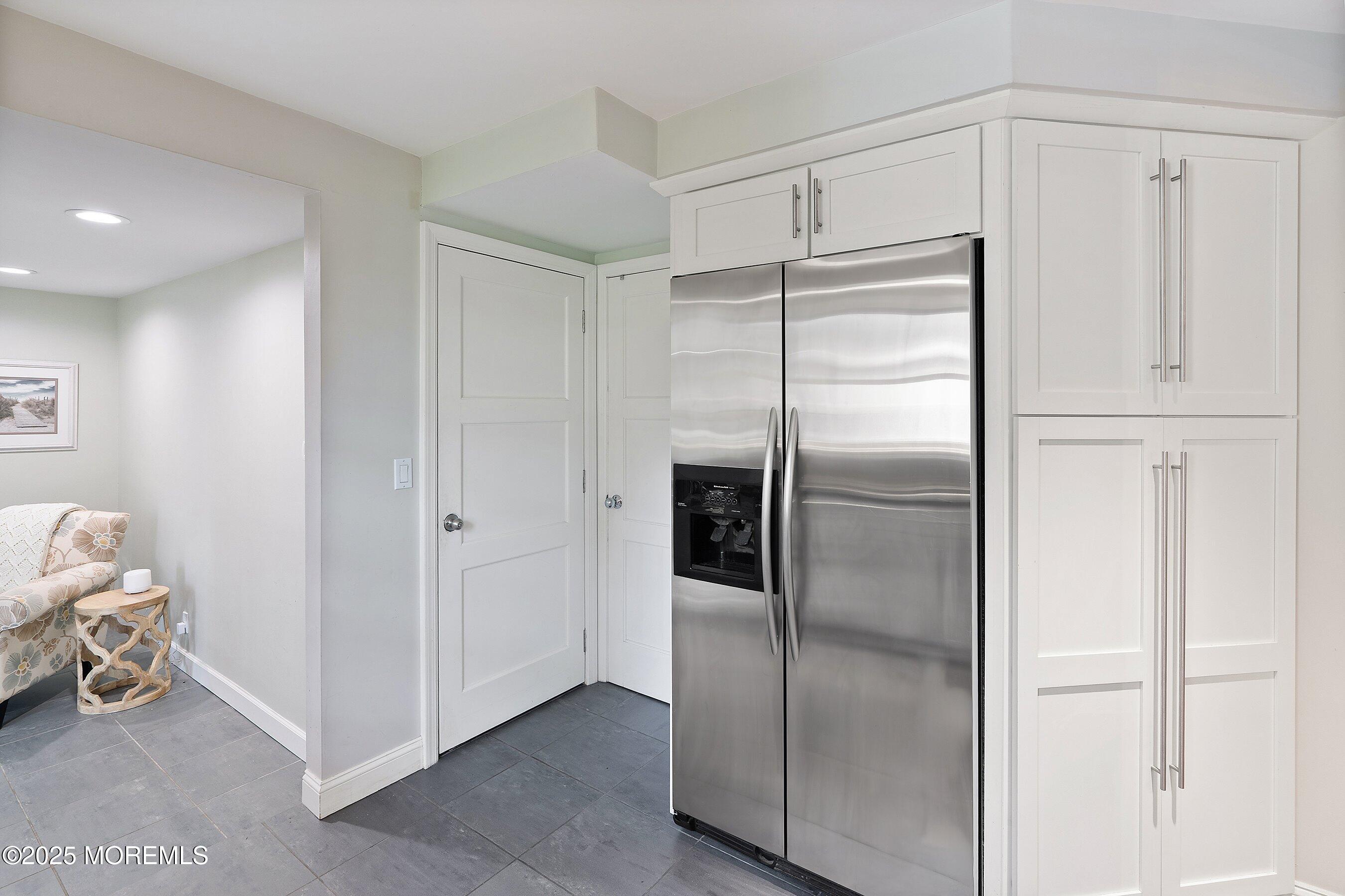 76 Ridge Road Fair Haven, NJ 07704 - Photo 9 of 22 a kitchen with stainless steel appliances refrigerator and cabinets