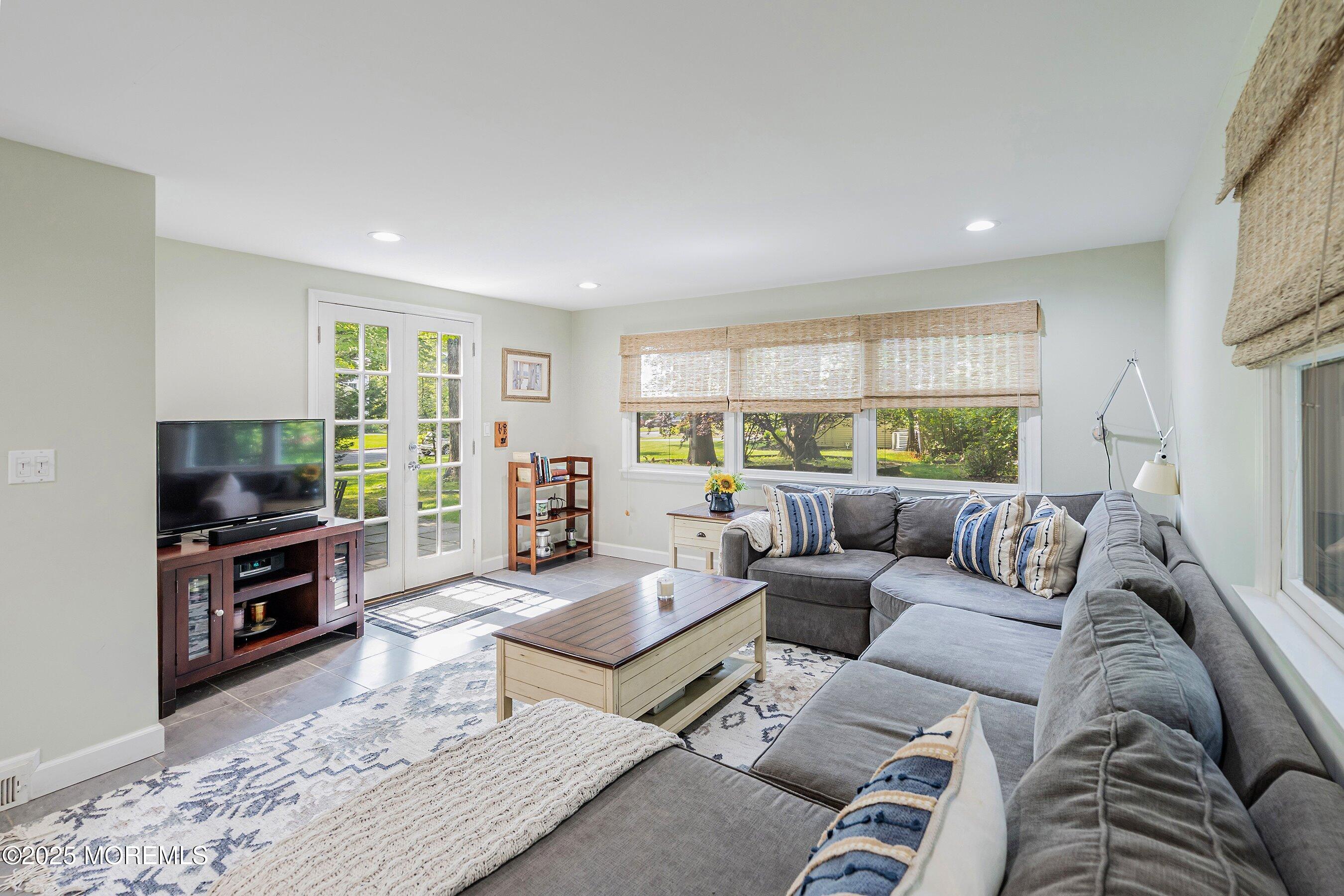 76 Ridge Road Fair Haven, NJ 07704 - Photo 10 of 22 a living room with furniture and a flat screen tv