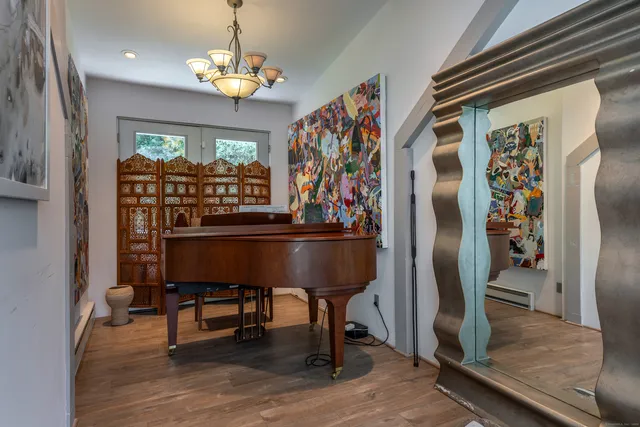 a kitchen with stainless steel appliances granite countertop a refrigerator and a table