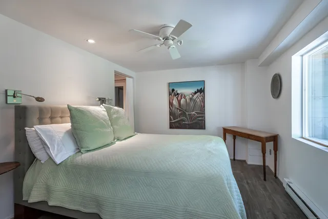 a bed room with a bed and a window