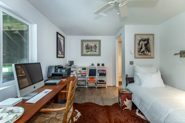a living room with furniture a rug and a table
