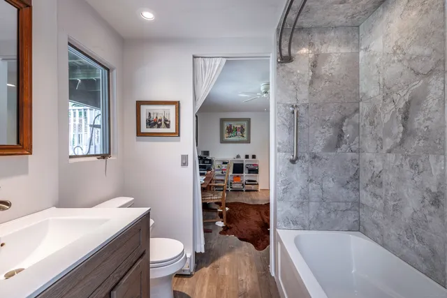 a bathroom with a sink a toilet and a bathtub