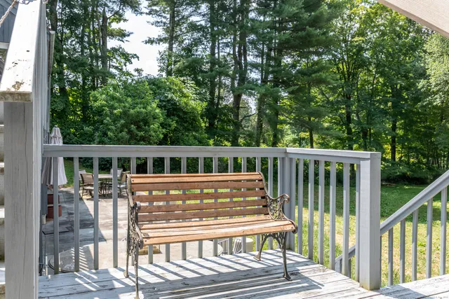 a view of a chair and table on the deck
