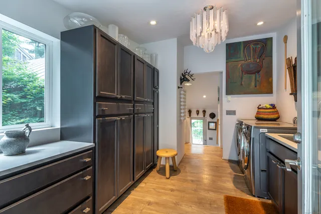 a kitchen with stainless steel appliances granite countertop a refrigerator and a stove top oven