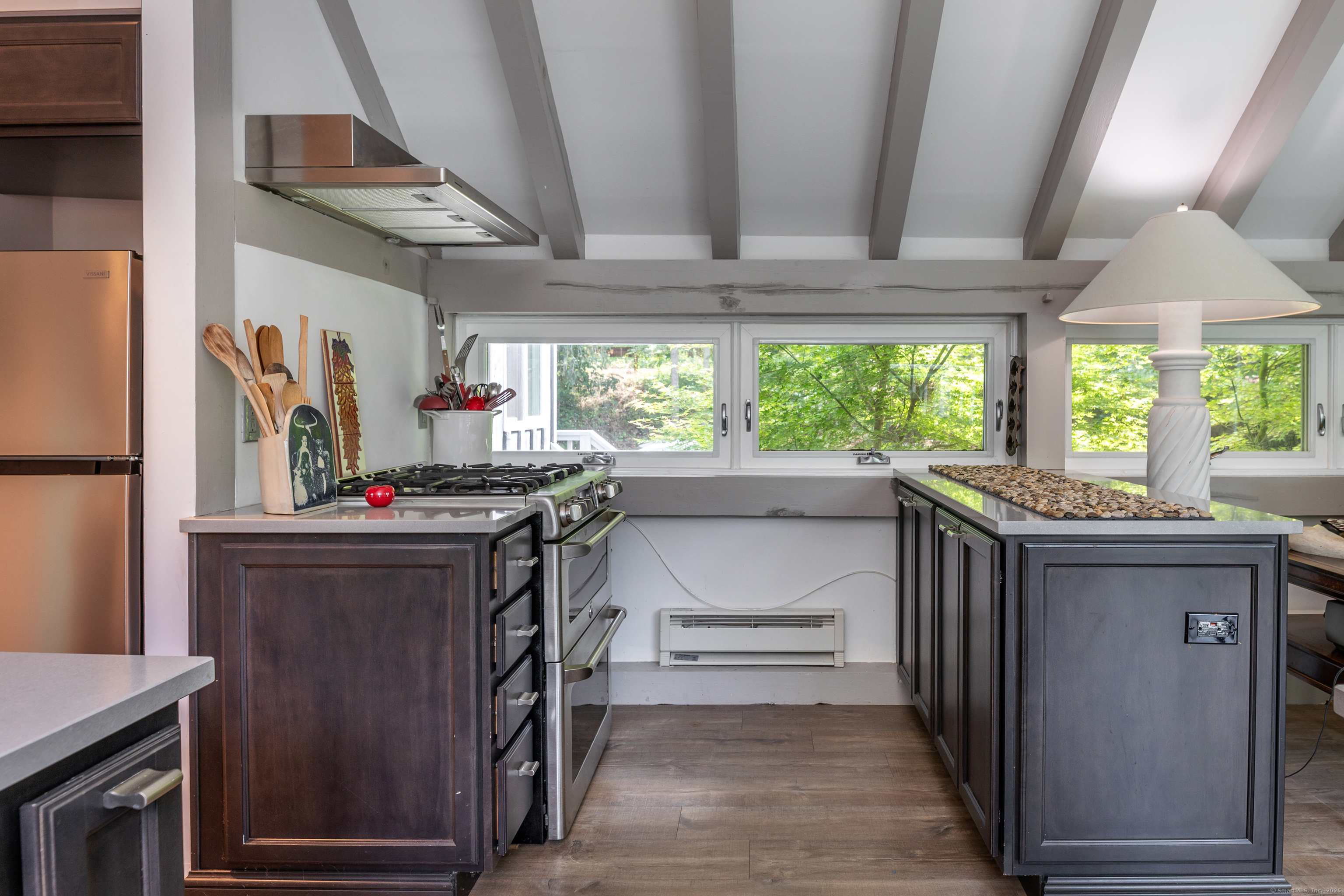 359 Nettleton Hollow Road Washington, CT 06793 - Photo 6 of 31 a kitchen with stainless steel appliances granite countertop a stove and a refrigerator
