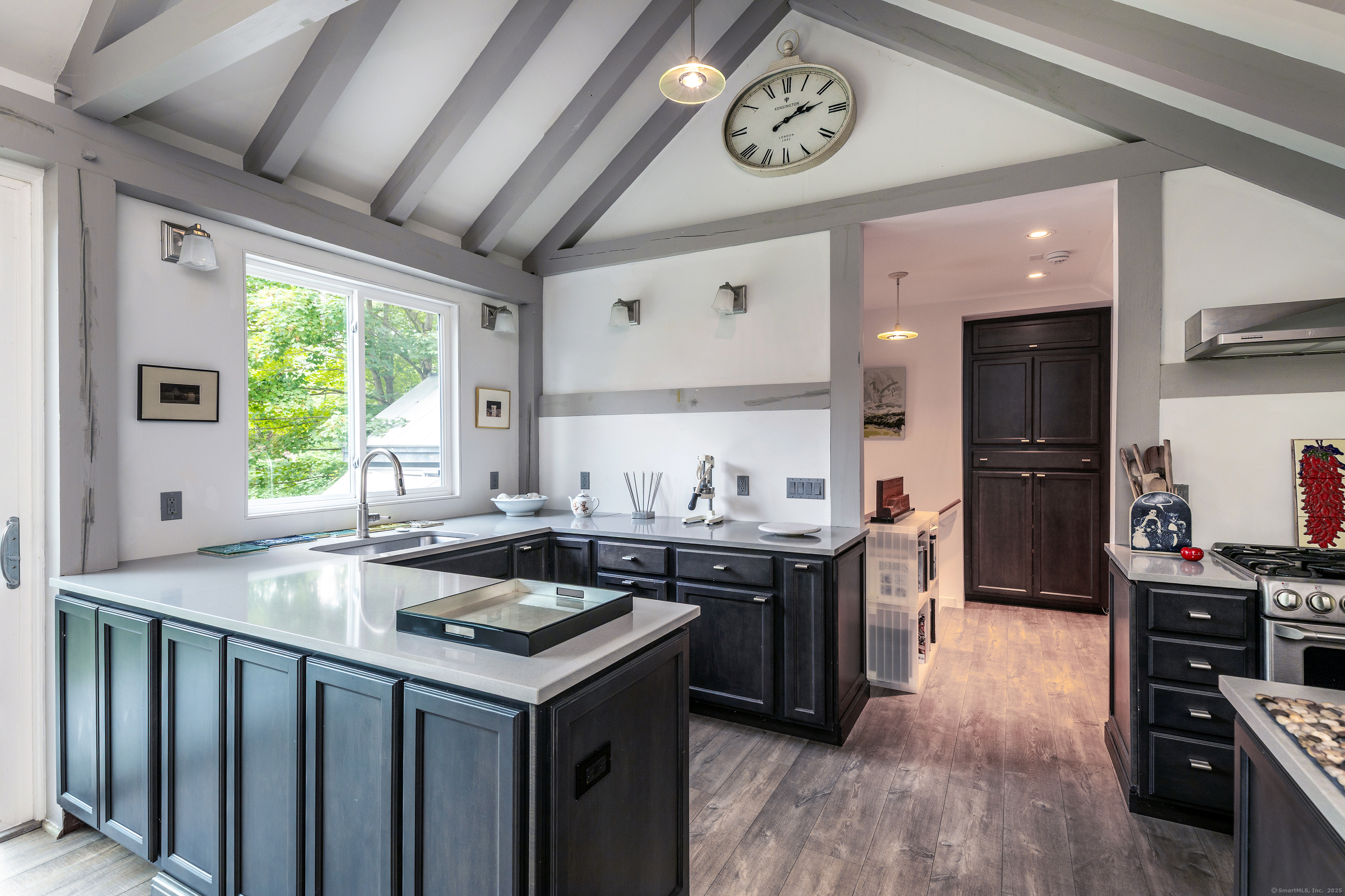 359 Nettleton Hollow Road Washington, CT 06793 - Photo 8 of 31 a kitchen with a stove a sink and a refrigerator