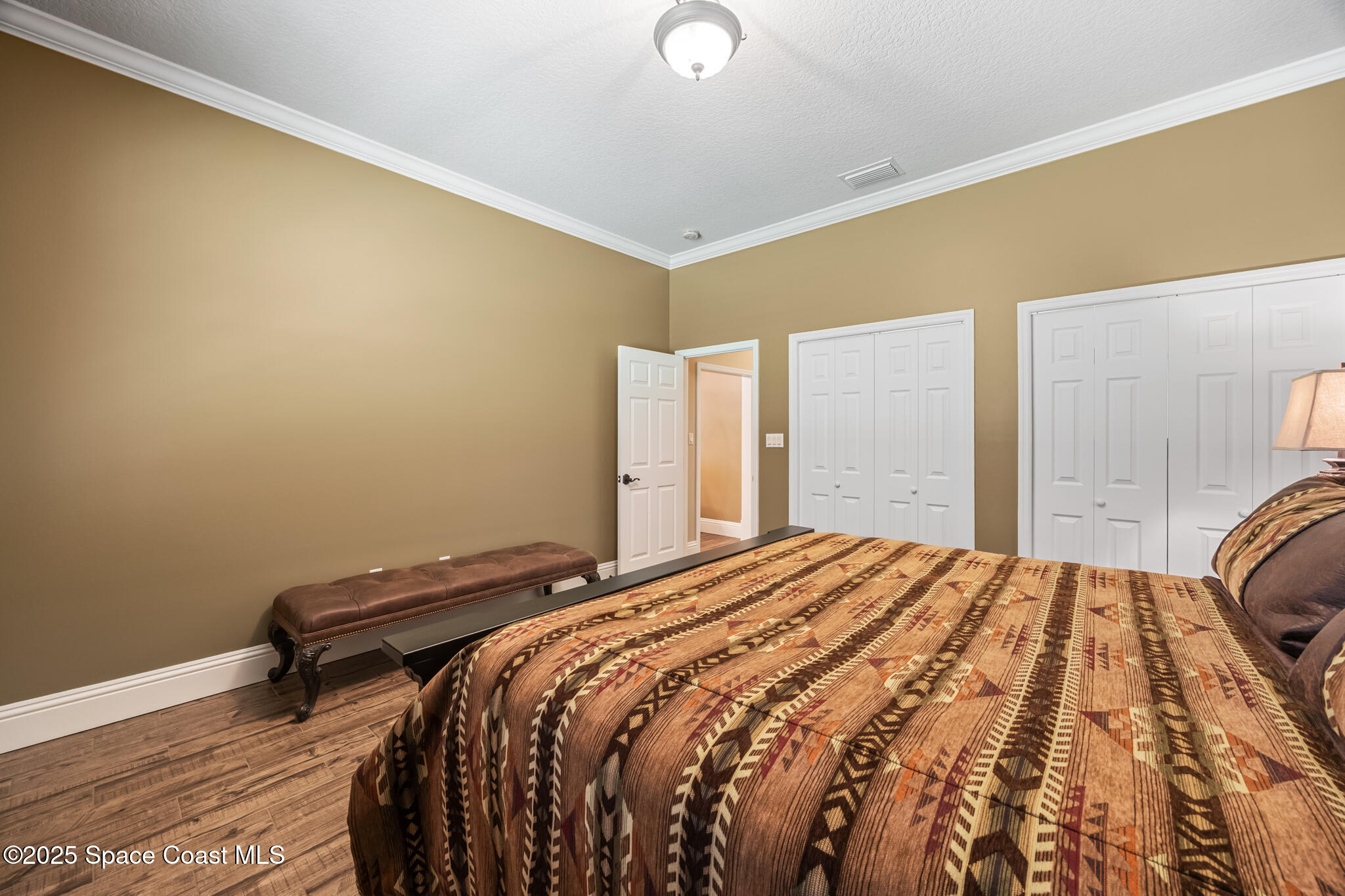 5495 Pine Street Cocoa, FL 32927 - Photo 13 of 45 a bedroom with a bed and a window
