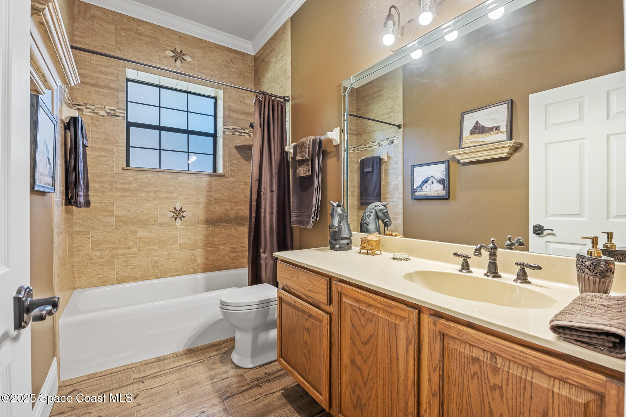 5495 Pine Street Cocoa, FL 32927 - Photo 14 of 45 a bathroom with a double vanity sink toilet mirror and shower