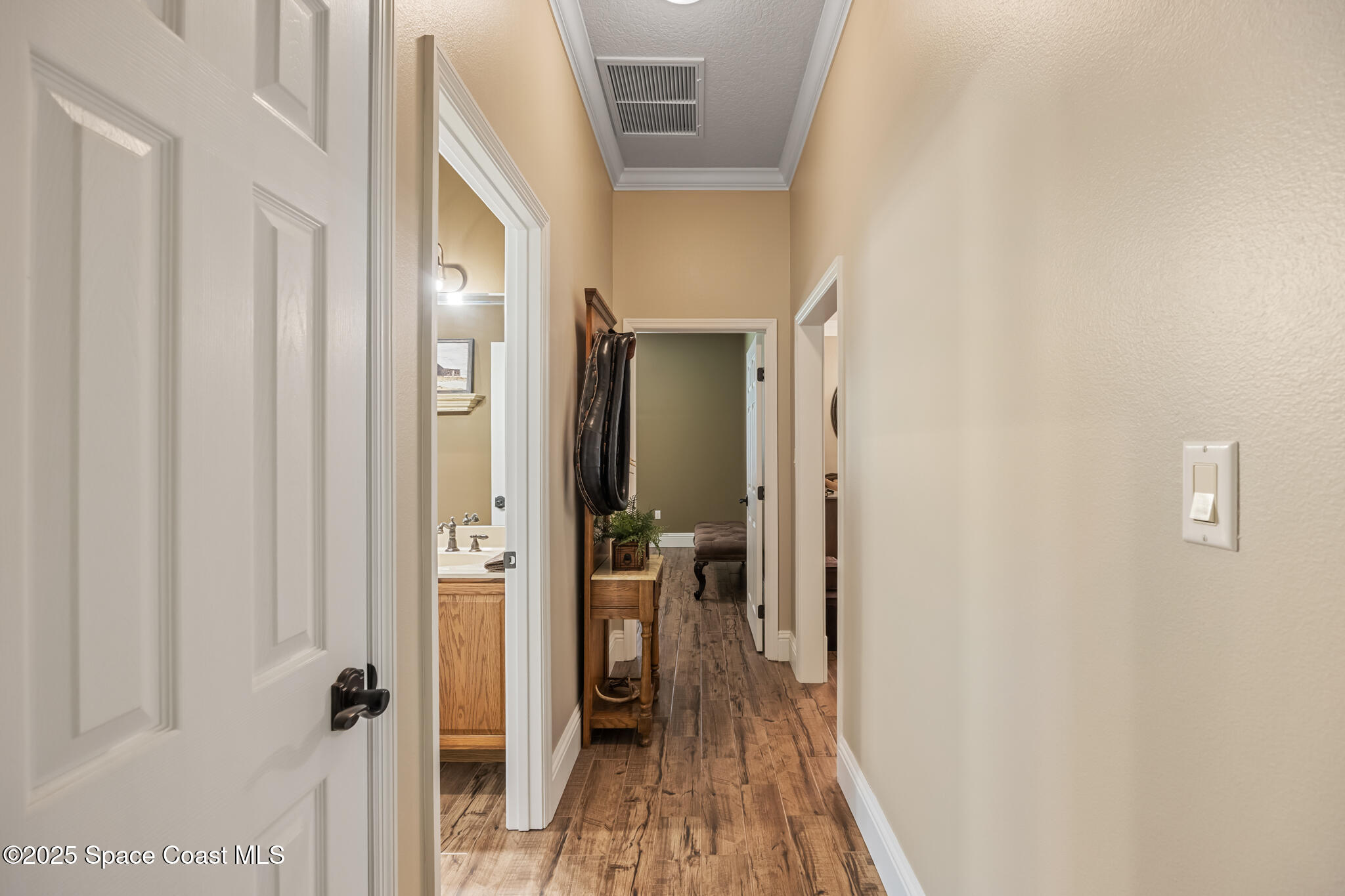 5495 Pine Street Cocoa, FL 32927 - Photo 15 of 45 a view of a hallway with wooden floor and staircase