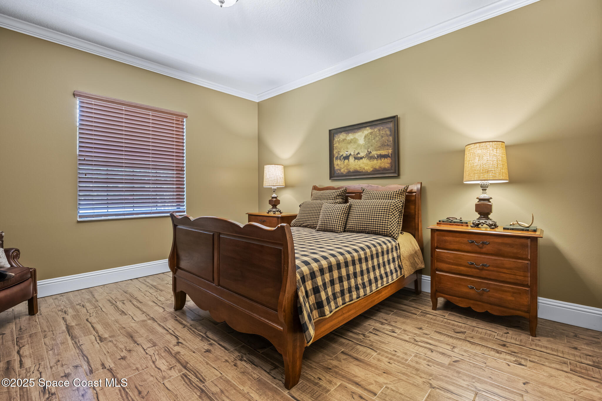 5495 Pine Street Cocoa, FL 32927 - Photo 17 of 45 a living room with a bed and a lamp on table