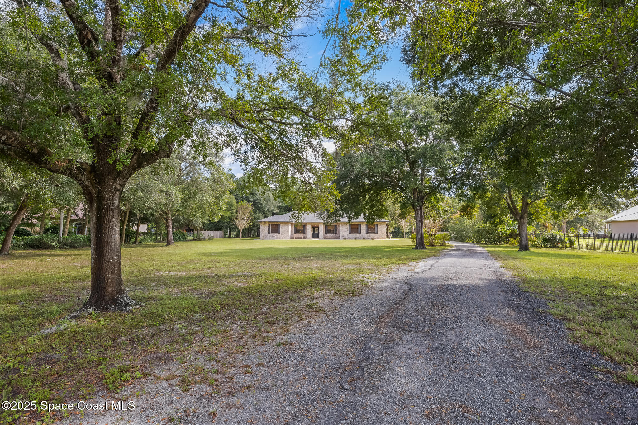 5495 Pine Street Cocoa, FL 32927 - Photo 2 of 45 a view of a trees in a yard