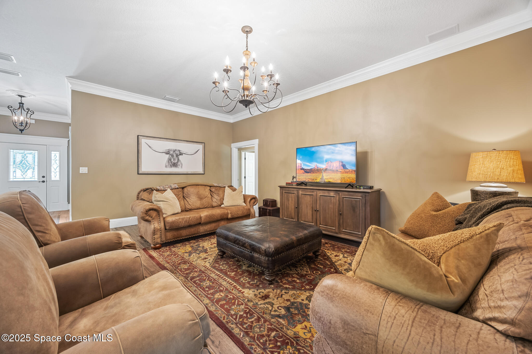 5495 Pine Street Cocoa, FL 32927 - Photo 25 of 45 a living room with furniture and a chandelier