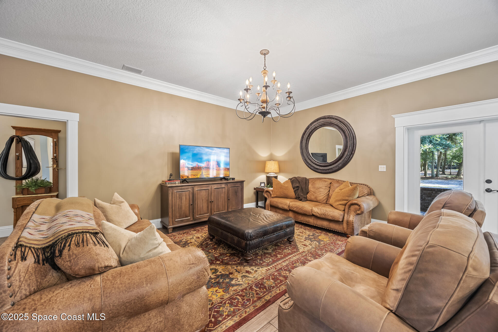 5495 Pine Street Cocoa, FL 32927 - Photo 26 of 45 a living room with furniture a clock and a window