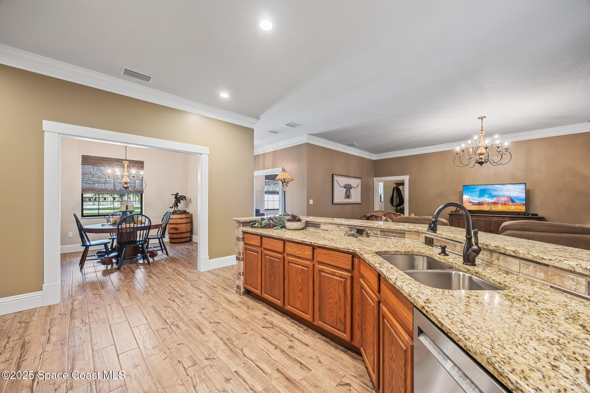 5495 Pine Street Cocoa, FL 32927 - Photo 28 of 45 a kitchen with stainless steel appliances granite countertop sink stove top oven and cabinets