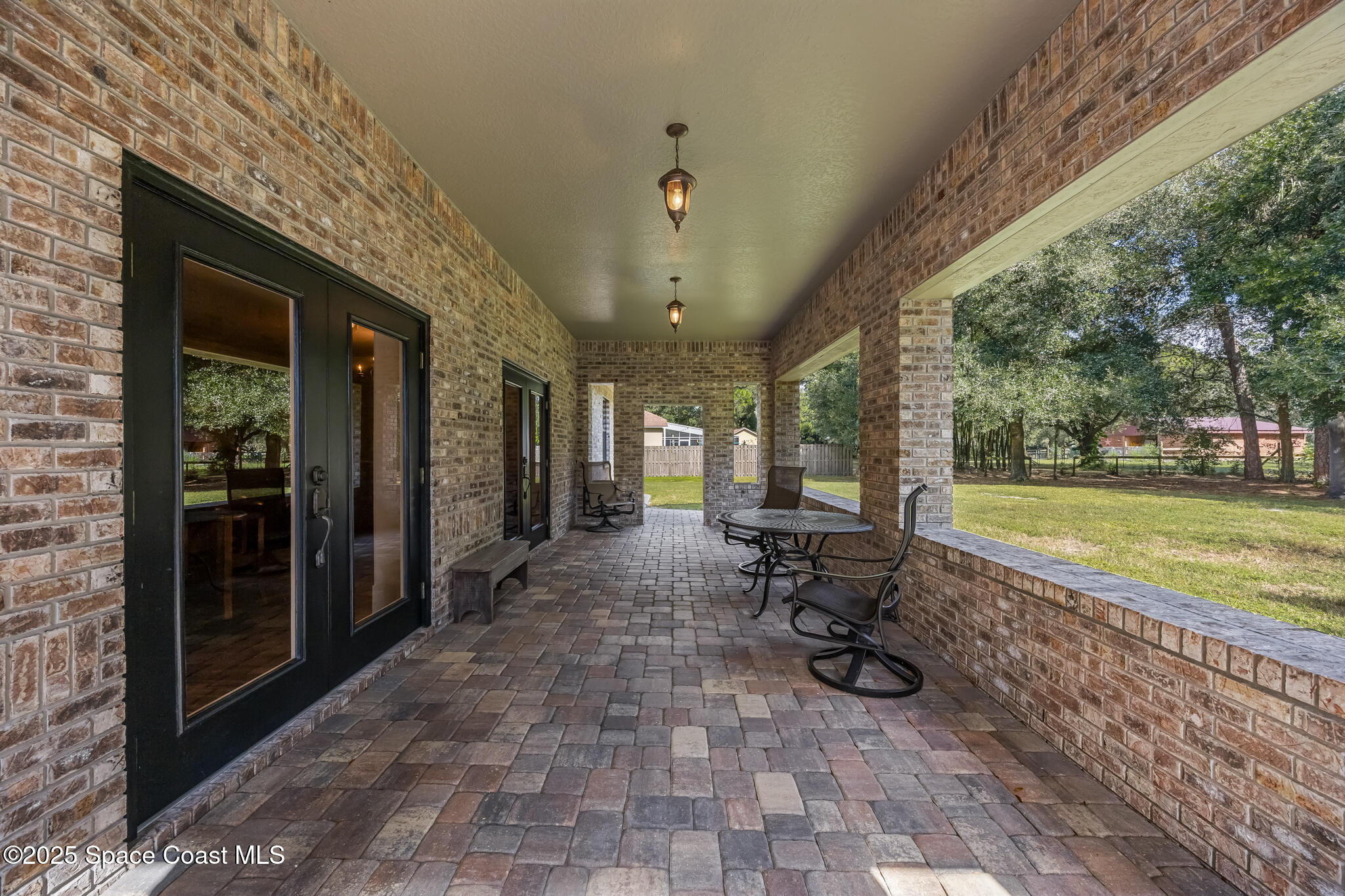 5495 Pine Street Cocoa, FL 32927 - Photo 33 of 45 a view of a porch with chairs and backyard
