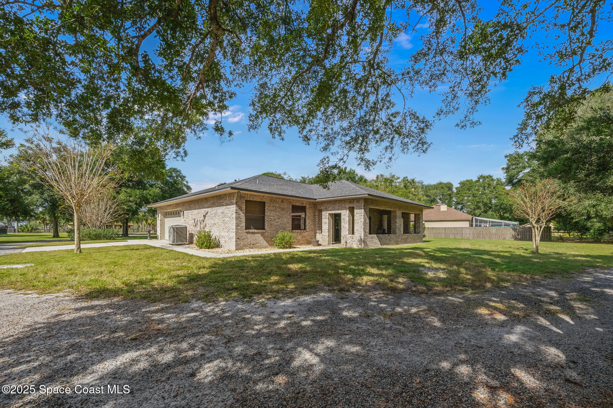 5495 Pine Street Cocoa, FL 32927 - Photo 34 of 45 a front view of a house with a yard
