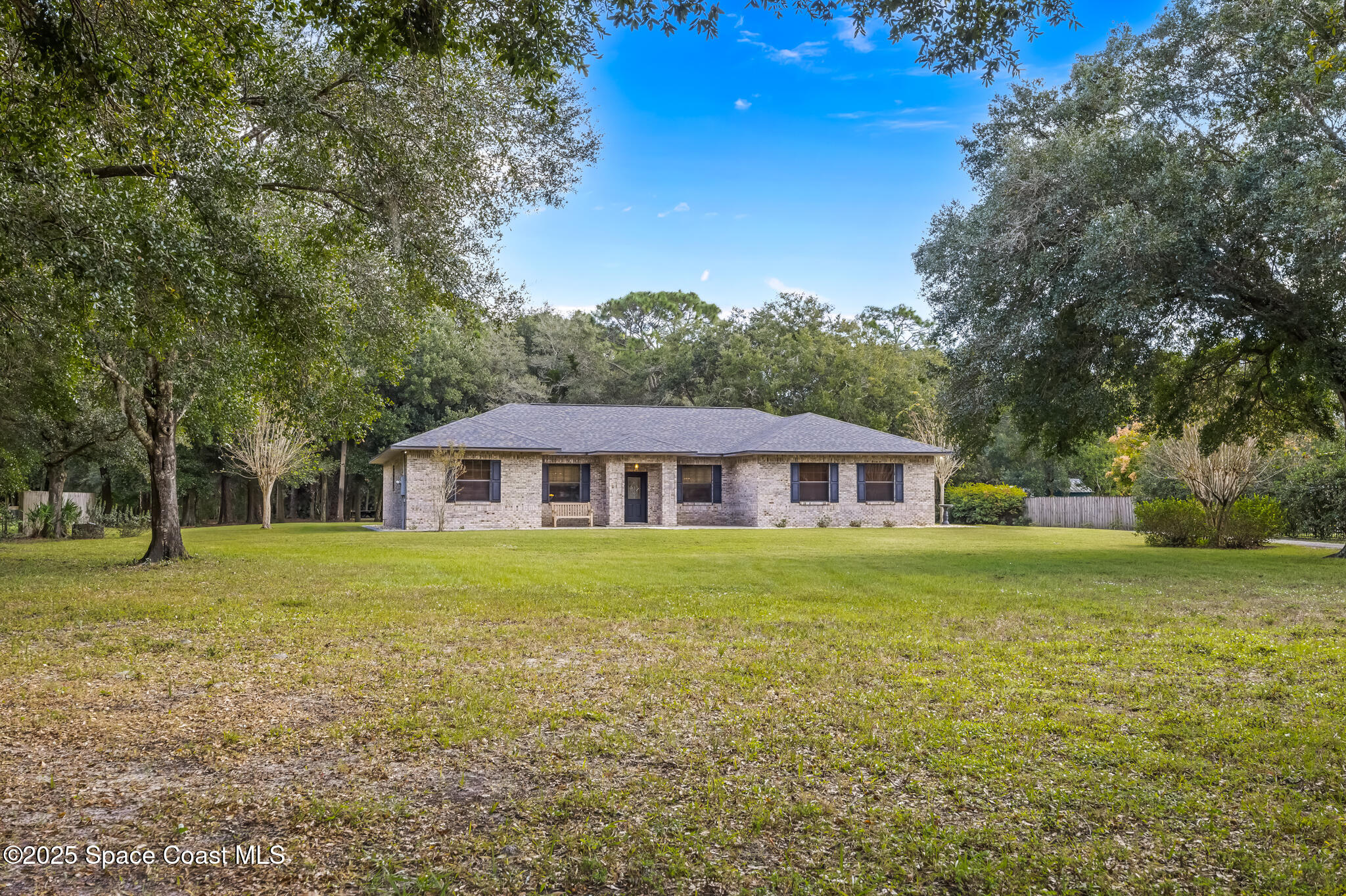 5495 Pine Street Cocoa, FL 32927 - Photo 39 of 45 a front view of a house with a yard