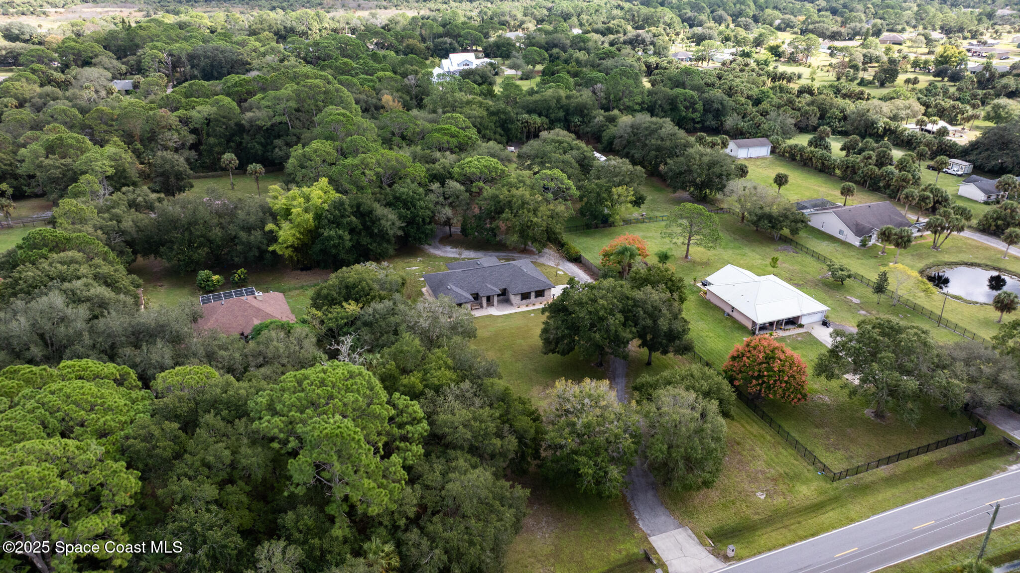 5495 Pine Street Cocoa, FL 32927 - Photo 42 of 45 an aerial view of residential house with outdoor space and swimming pool