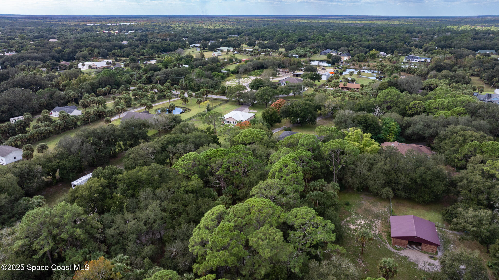 5495 Pine Street Cocoa, FL 32927 - Photo 45 of 45 an aerial view of residential houses with outdoor space and trees