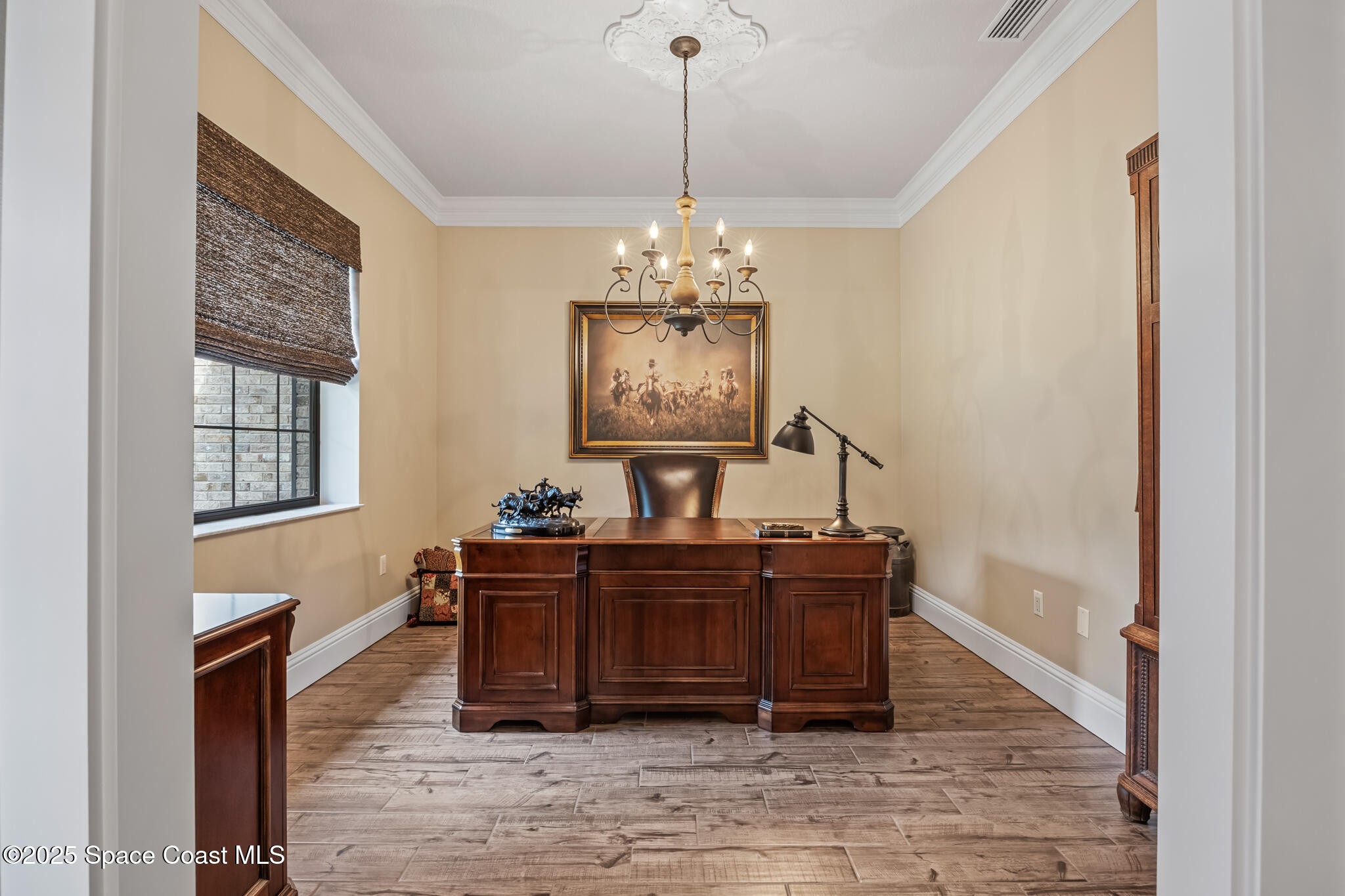 5495 Pine Street Cocoa, FL 32927 - Photo 6 of 45 a living room with furniture and a chandelier