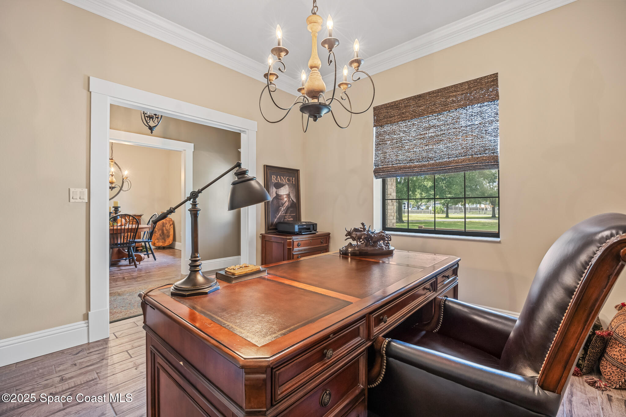 5495 Pine Street Cocoa, FL 32927 - Photo 7 of 45 a room with a table chairs and a chandelier