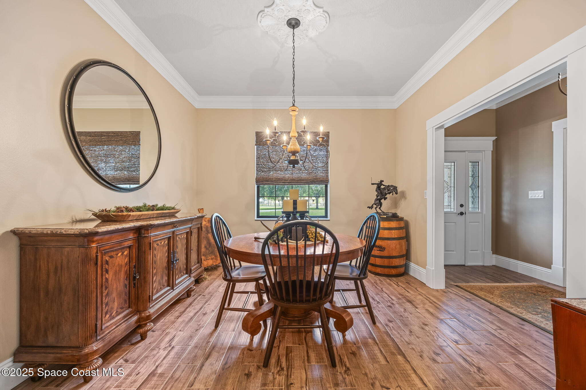 5495 Pine Street Cocoa, FL 32927 - Photo 8 of 45 a view of a dining room with furniture window and wooden floor