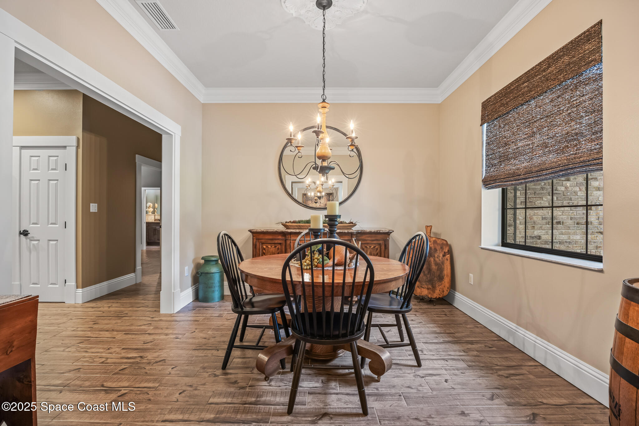 5495 Pine Street Cocoa, FL 32927 - Photo 9 of 45 a view of a dining room with furniture window and wooden floor