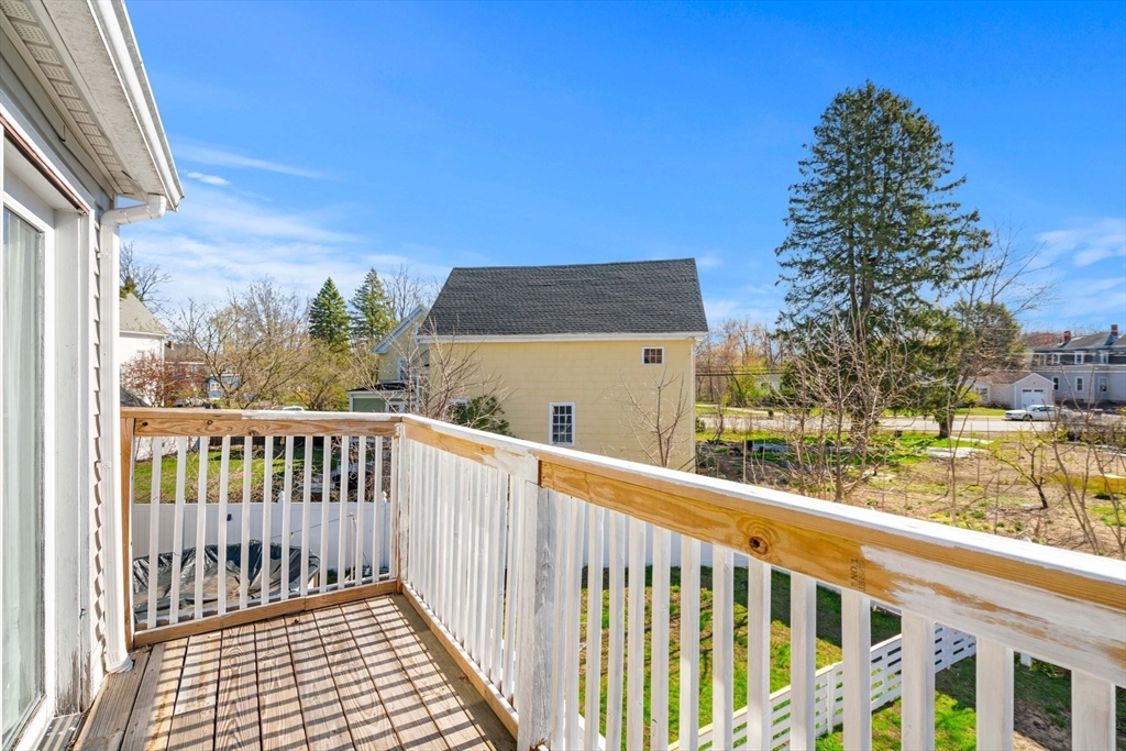 271 Broadway Haverhill, MA 01832 - Photo 24 of 41 a view of a balcony with wooden floor and fence