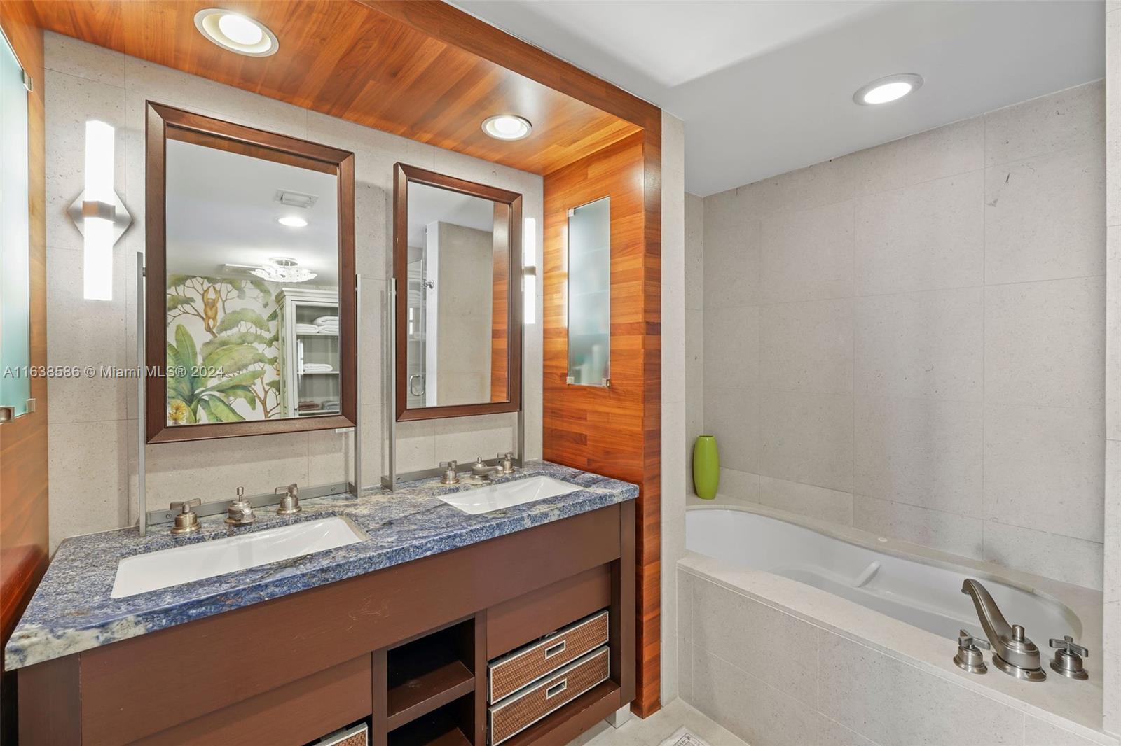 6799 Collins Avenue, Unit 1601 Miami Beach, FL 33141 - Photo 24 of 64 a bathroom with a granite countertop sink and a bathtub