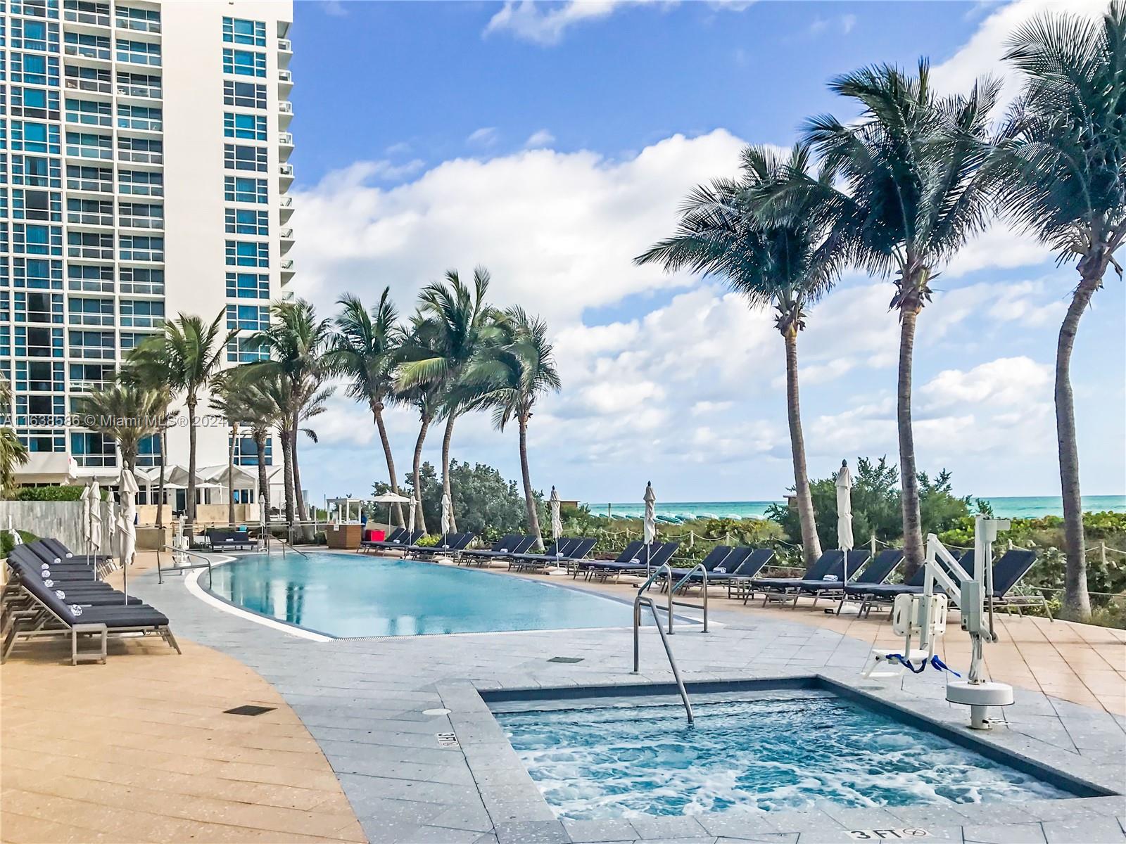 6799 Collins Avenue, Unit 1601 Miami Beach, FL 33141 - Photo 37 of 64 a view of outdoor space with palm trees