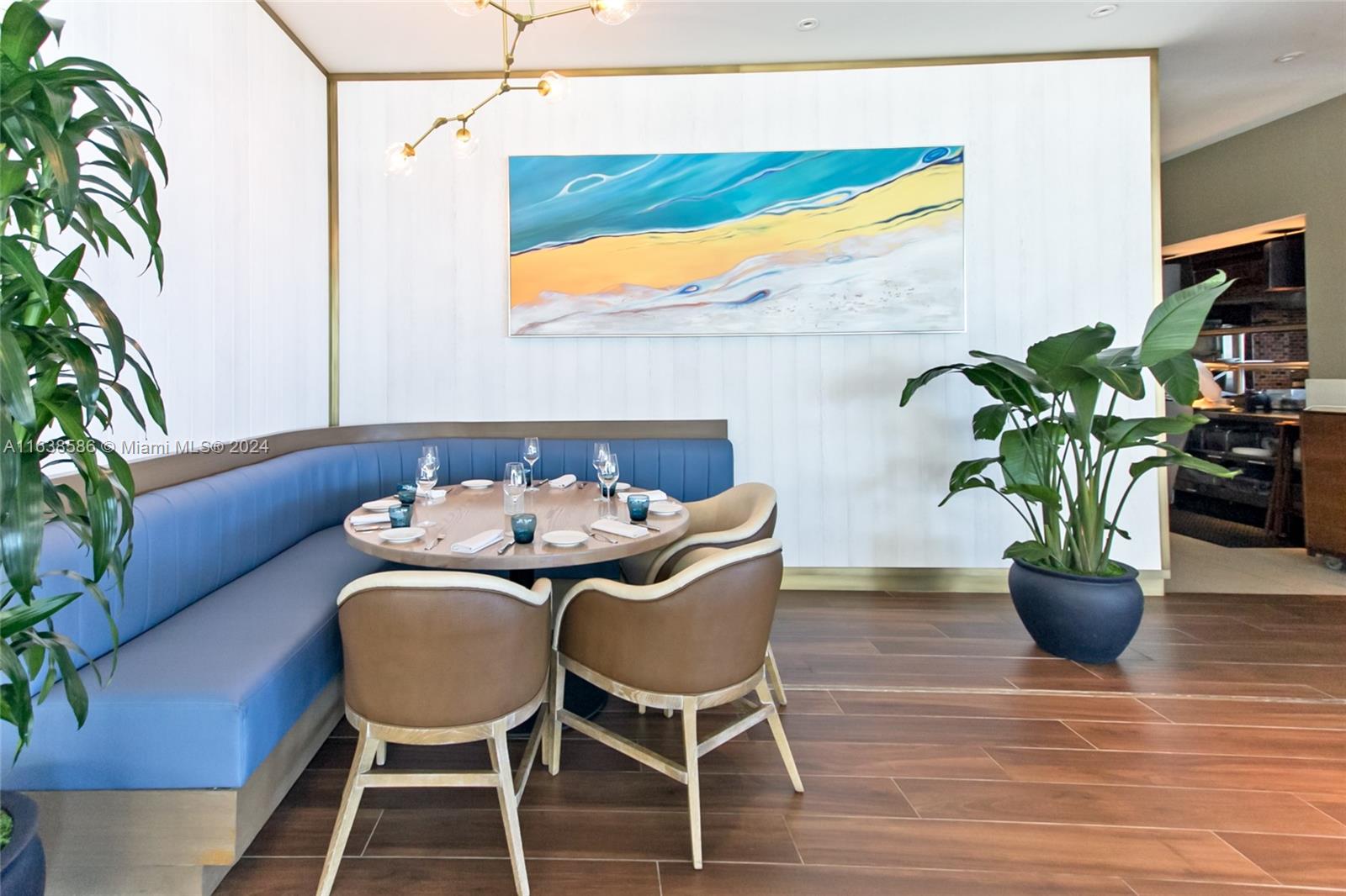 6799 Collins Avenue, Unit 1601 Miami Beach, FL 33141 - Photo 46 of 64 a dining room with furniture and wooden floor