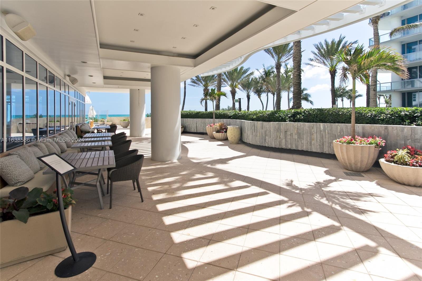6799 Collins Avenue, Unit 1601 Miami Beach, FL 33141 - Photo 48 of 64 a living room filled with furniture and a table