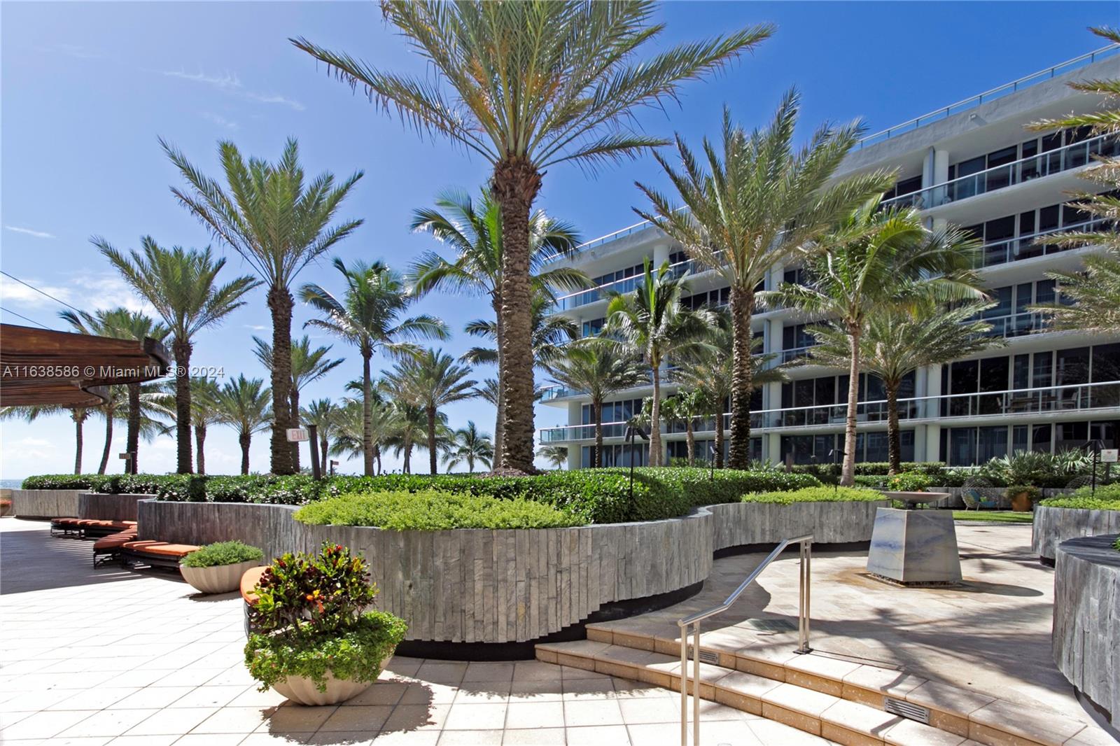 6799 Collins Avenue, Unit 1601 Miami Beach, FL 33141 - Photo 55 of 64 a view of a yard with a fountain and a slide