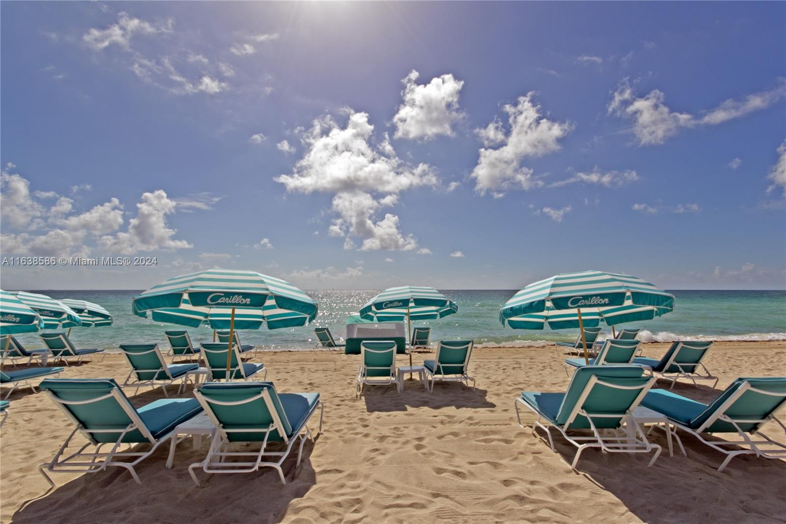 6799 Collins Avenue, Unit 1601 Miami Beach, FL 33141 - Photo 59 of 64 a view of an chairs and table in patio