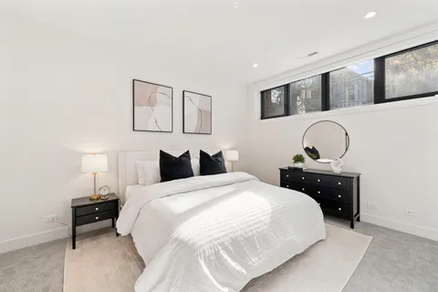 a bedroom with a bed and a dresser