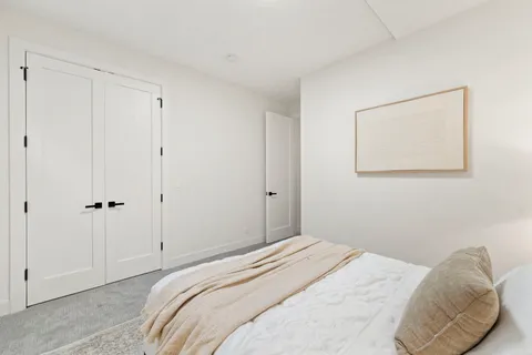 a bedroom with a bed and a shower