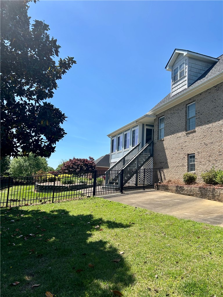 116 Buttercup Trail Anderson, SC 29621 - Photo 12 of 49 This residence showcases a charming exterior with a spacious yard, perfect for outdoor enjoyment.