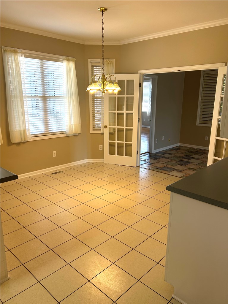 116 Buttercup Trail Anderson, SC 29621 - Photo 14 of 49 This bright and airy space offers elegant French doors, an inviting dining area, and tiled floors.
