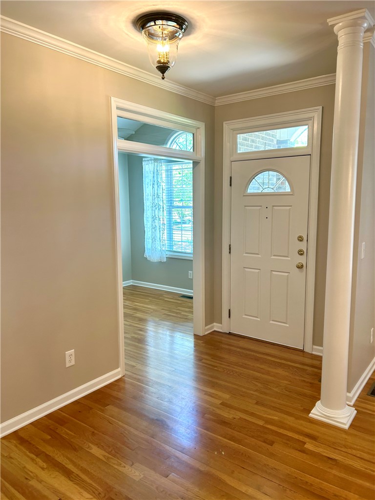 116 Buttercup Trail Anderson, SC 29621 - Photo 2 of 49 This inviting entryway showcases polished hardwood flooring and elegant crown molding.